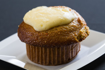 Close up shot of fresh bran muffin with icing