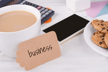 Empty note paper with coffee, cookies and calculator