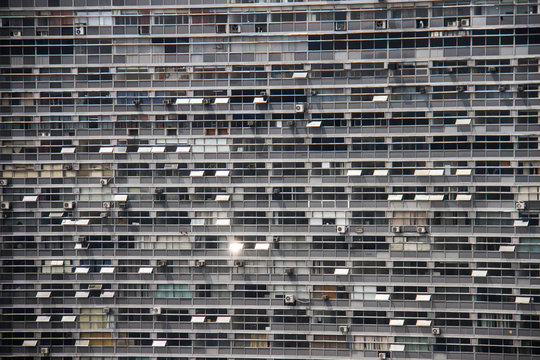 Detail of a facede of a huge office building with rectangular windows.