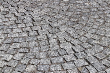 Stone`s pavement. Arthistic texture and background. Element of old street. Exterior`s decoration.