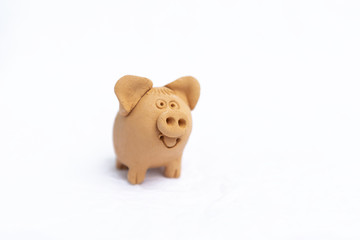 Cute pig clay doll isolate on white background, garden decoration 