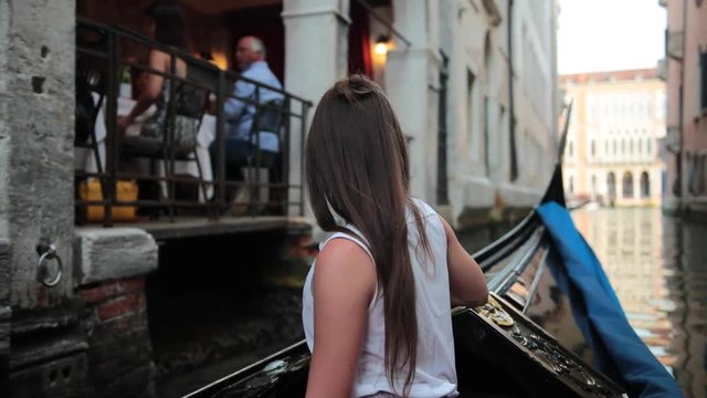 Girl enjoys Gondola ride in venice at sun set.
Recorden on Canon 1DX MII in 4k 60fps.