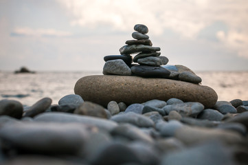 A pyramid of stones against a blue sky