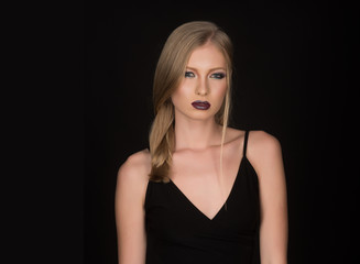 Naklejka premium Hairdresser and beauty salon. Makeup look and skincare of sensual girl. Sexy woman with blonde hair isolated on black. Girl with pigtail blond hair. Fashion model with makeup and stylish hairdo.