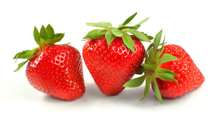 Three strawberries isolated on white background.
