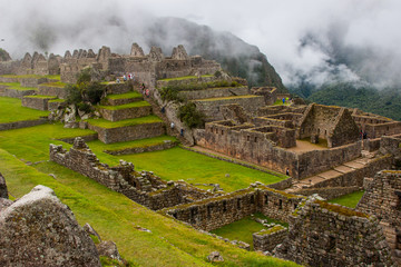 Ruins of Machu Picchu ancient lost city in the Andes nature. Moutains in mist. Peru. South America. No people. © Alessandro Vecchi