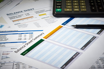 balance sheet summary and balance sheets with calculator and pen