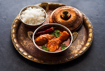 Indian dish Spicy Chicken Curry. Spicy chicken legs with rice