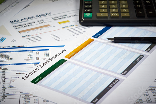 balance sheet summary and balance sheets with calculator and pen