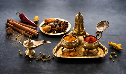 Spice, spicy and seasoning on a black concrete background. Indian food spices concept