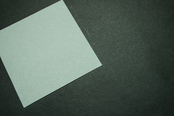 Blank paper on dark background.