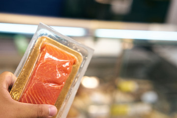 red fish in transparent packaging, supermarket