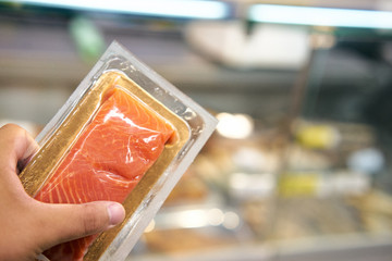 red fish in transparent packaging, supermarket