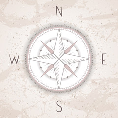 Vector illustration with a vintage compass or wind rose on grunge background.