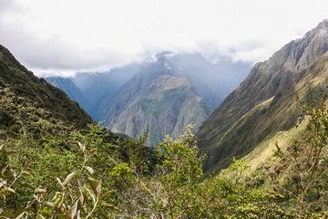 Beautiful background image of the wild nature of the Andes mountains and clouds along the Inca Trail. Peru. South America. No people.