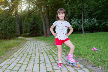 An active sporty child on rollerblades, in the open air.