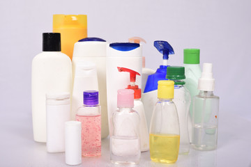 Many white plastic bottles on white background.