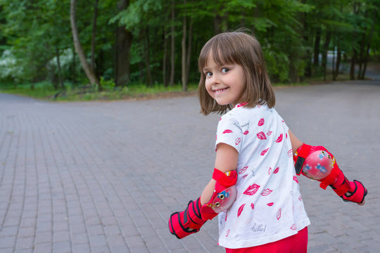 A happy girl is doing active sport, in the open air.