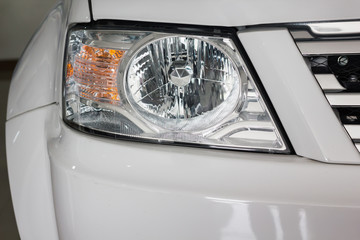 Focused at new headlamp of blond car © kazitafahnizeer
