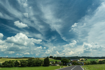 Big clouds over land in summer time, Austria.