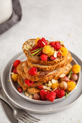French toast with berries and syrup, vertical. Healthy vegan food concept.