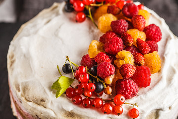 Healthy vegan cake with coconut cream and berries. Healthy vegan food concept.