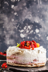 Healthy vegan cake with coconut cream and berries, vertical. Healthy vegan food concept.
