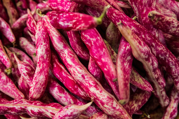 City market stall with fresh cranberry beans. Rome. Europe. No people.