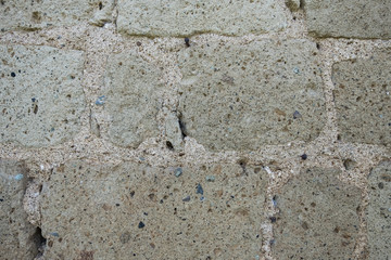 Beautiful wallpaper background of a wall made giant concrete bricks. No people.