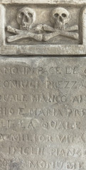 Crossbones carved in a tombstone