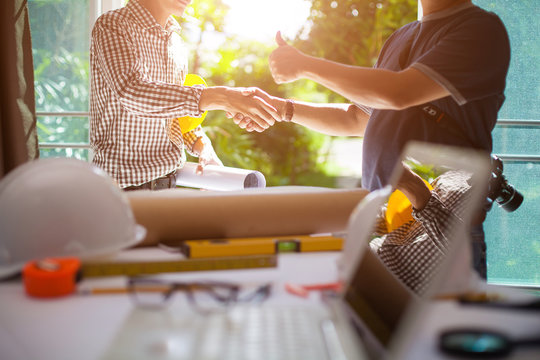 Concept Agreement between the employer and architect Nick and desk of Architectural project in construction site or office building  