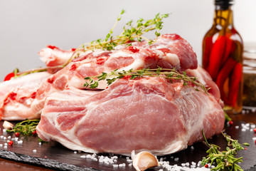 The carcass of a pig is divided into parts, an edge, a fillet, a scapula, a neck, a notch, a ham, a ham, a back. With spices, marasm. honest, pepper and salt. Raw pork meat. background image.