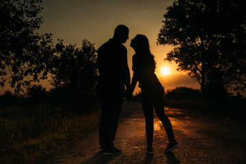 silhouette of beautiful Couple on the sunset