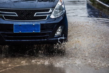 dirty water splash after vehicle roaring by
