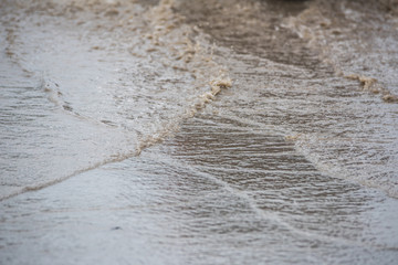 dirty water splash after vehicle roaring by