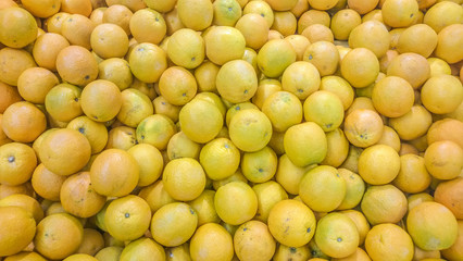 A bunch of orange-yellow oranges