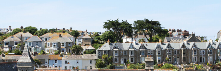 Seaside Village of St. Ives, Cornwall, UK. View over old town with typical houses in afternoon summer sunshine.  Saint Ives, Cornwall, England, UK