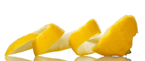 Thick yellow lemon peel cutting on spiral isolated on white