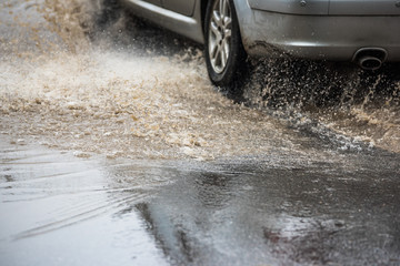 dirty water splash after vehicle roaring by