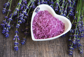 Heart-shaped bowl with sea salt  and fresh lavender flowers