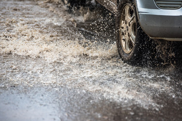 dirty water splash after vehicle roaring by