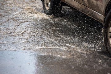 dirty water splash after vehicle roaring by