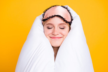 Portrait of funny and funky happy young woman with blindfellen on head and wrapped in white...