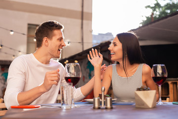 Beautiful girlfriend. Blonde-haired man wearing plain white shirt interacting his beautiful girlfriend