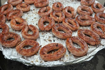 Sausages baked in food foil paper. Festival of Ukrainian national cuisine in the open air, Ivano-Frankivsk, Ukraine
