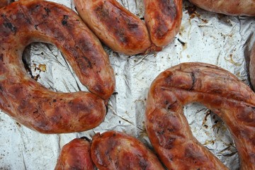 Sausages baked in food foil paper. Festival of Ukrainian national cuisine in the open air, Ivano-Frankivsk, Ukraine