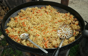 Cooked pilaf in a large cauldron. Festival of Ukrainian national cuisine in the open air, Ivano-Frankivsk, Ukraine