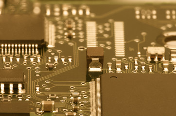 Electronic board. The board features elements: chips, diodes, capacitors, chokes. Shallow depth of...