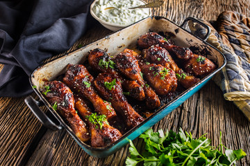 Grilled roasted and barbecue chicken legs in pan