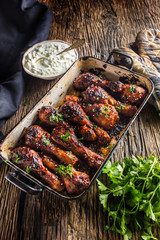 Grilled roasted and barbecue chicken legs in pan